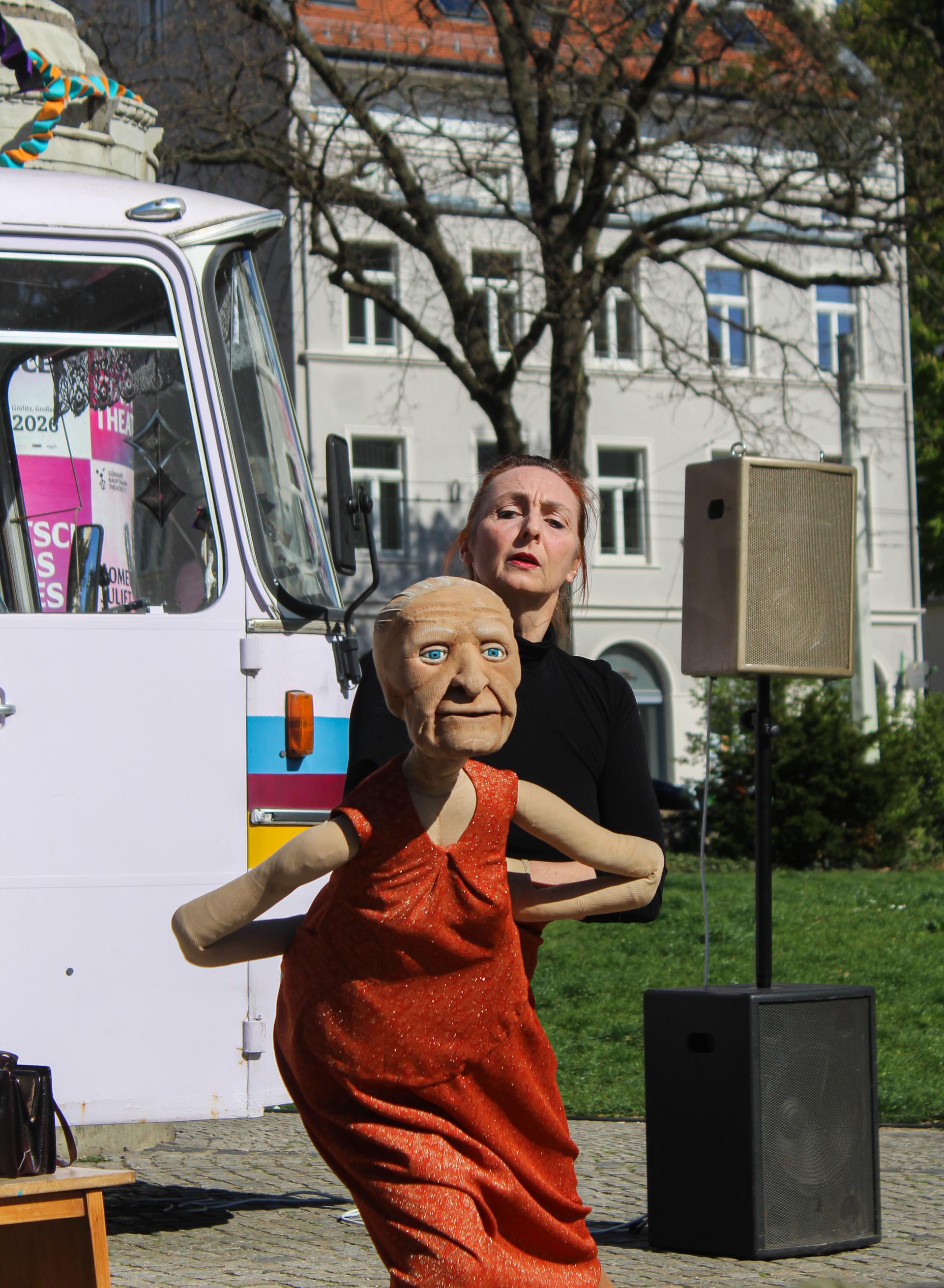 Performer with a life-size moving puppet