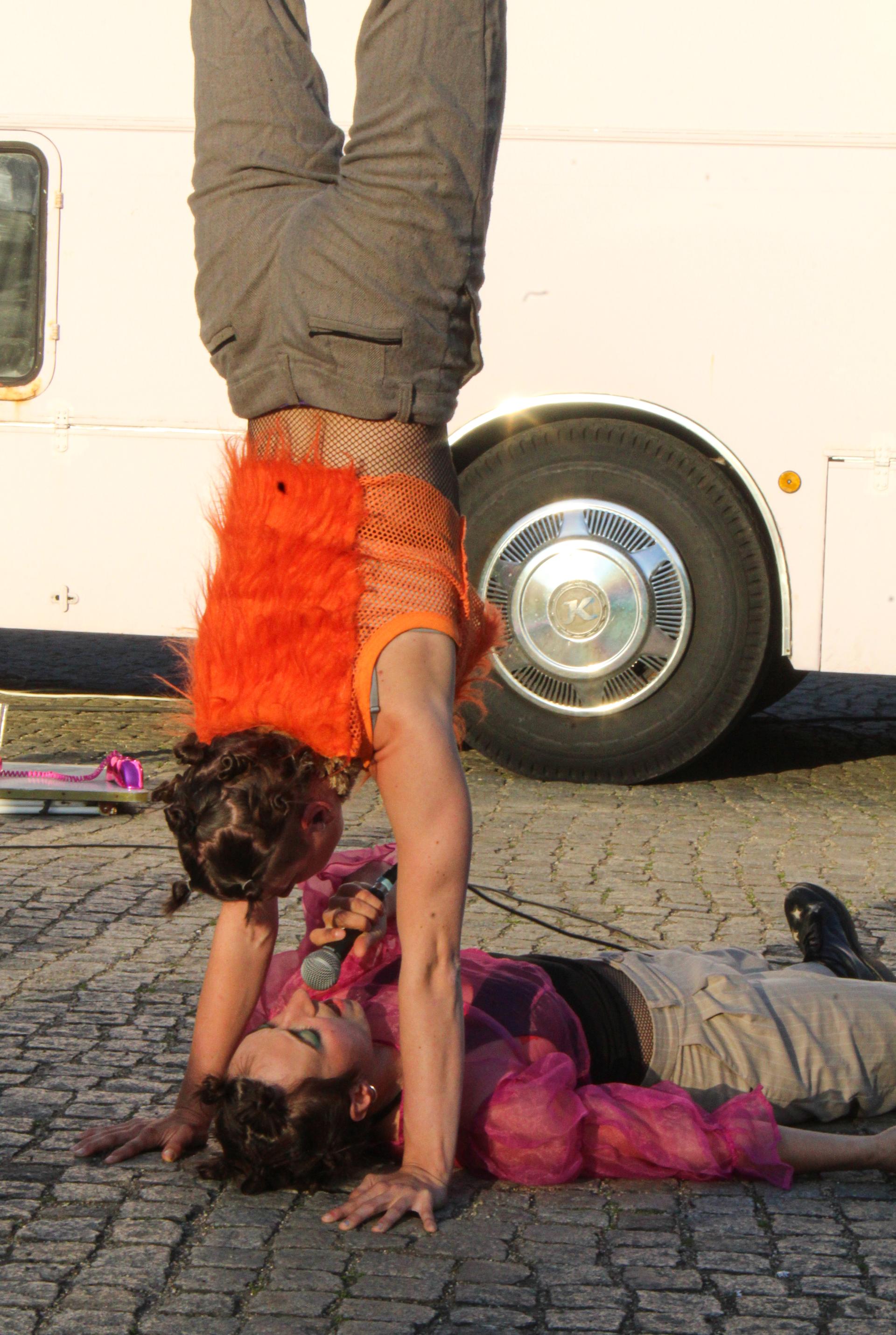 Two performers in an acrobatic pose